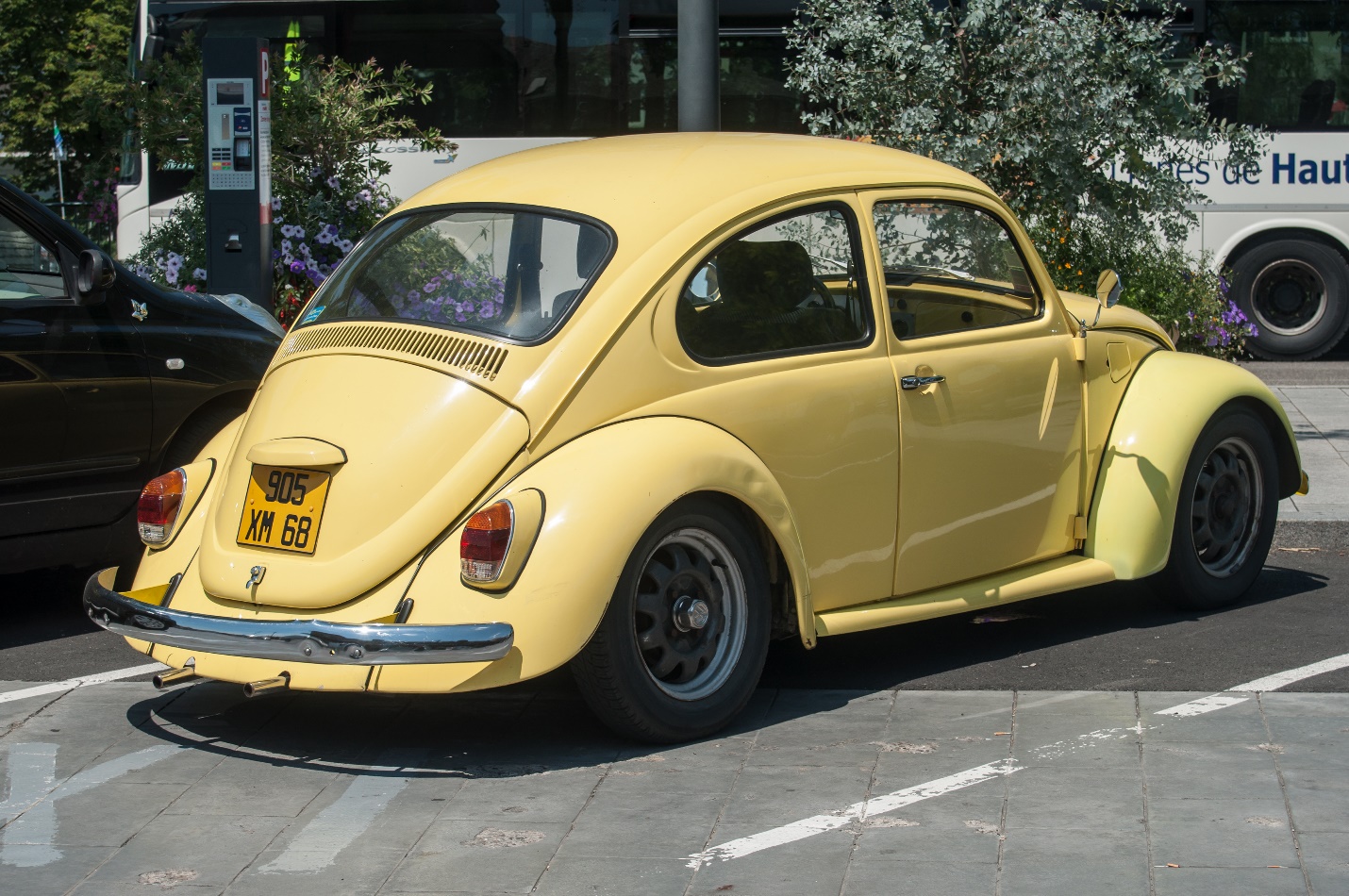old Volkswagen yellow beetle parked in the street